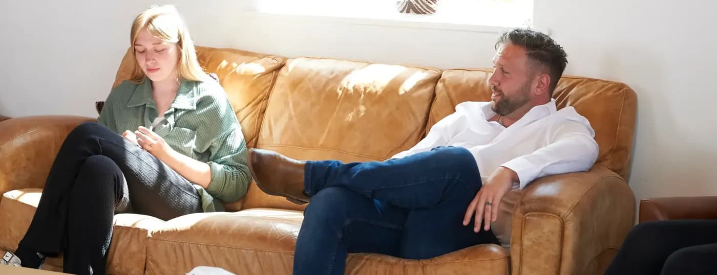 people talking on sofa