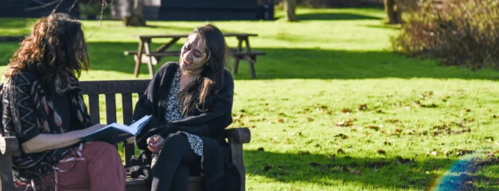 Women chatting on bench